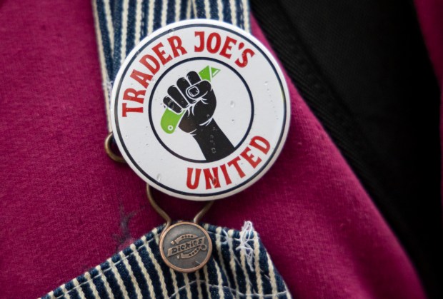 Trader Joe's workers wear buttons as they announce the filing for a union election, April 7, 2024, in North Center. (Brian Cassella/Chicago Tribune)