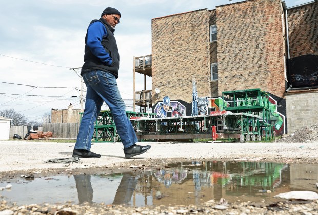 Charles Perry poses for a portrait outside a storefront he recently purchased on Friday, March 22, 2024, on 95th St. in Chicago. Perry hopes to turn the storefront into an ice cream parlor. (Vincent Alban/Chicago Tribune)