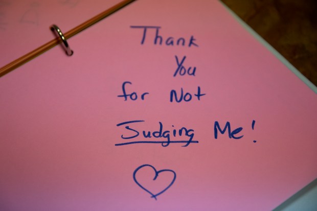 Notes written by patients to other patients are kept in a binder at Hope Clinic for Women in Granite City, Ill. (Erin Hooley/Chicago Tribune)