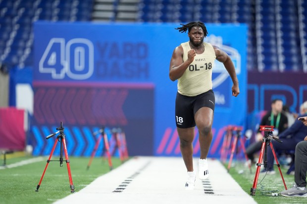 Offensive lineman Olu Fashanu runs the 40-yard dash at the NFL combine on March 3, 2024, in Indianapolis. (AP Photo/Michael Conroy)
