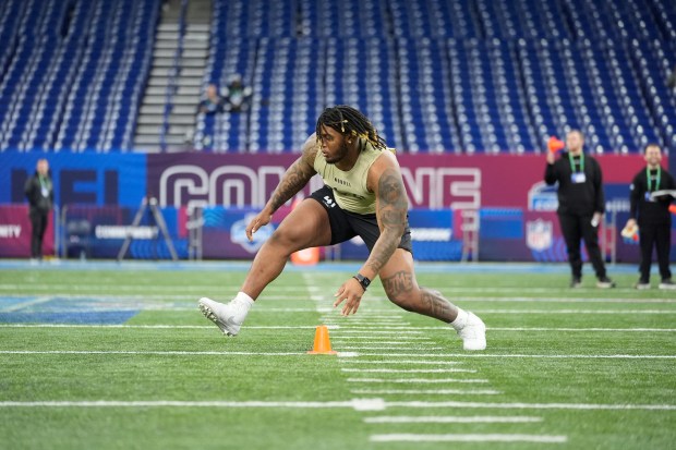JC Latham runs a drill at the NFL combine on March 3, 2024, in Indianapolis. (AP Photo/Michael Conroy)