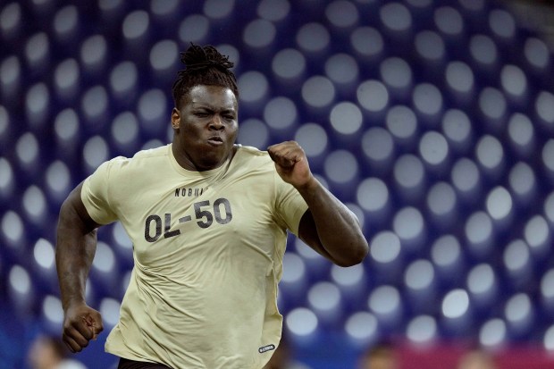 Georgia offensive lineman Amarius Mims runs the 40-yard-dash during the NFL combine on March 3, 2024, in Indianapolis. (AP Photo/Charlie Riedel)