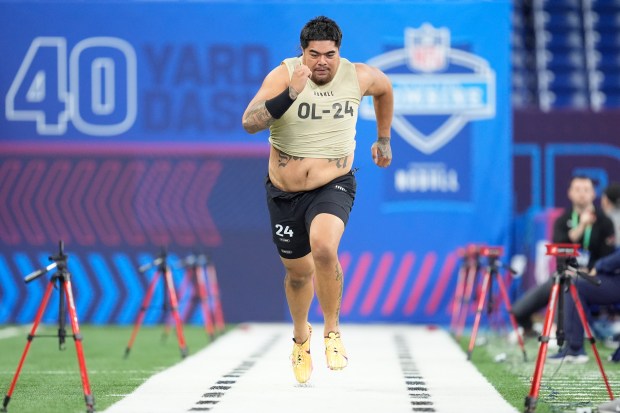 Offensive lineman Taliese Fuaga runs the 40-yard dash at the NFL combine on March 3, 2024, in Indianapolis. (AP Photo/Michael Conroy)