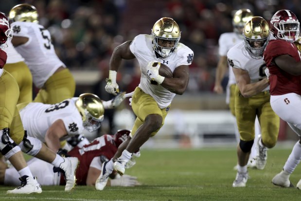Notre Dame running back Audric Estime runs for a touchdown against Stanford on Nov. 25, 2023, in Stanford, Calif.. (AP Photo/Jed Jacobsohn)