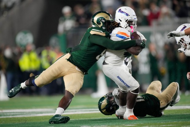 Colorado State defensive lineman Mohamed Kamara stops Boise State running back Ashton Jeanty on Oct. 14, 2023, in Fort Collins, Colo. (AP Photo/David Zalubowski)