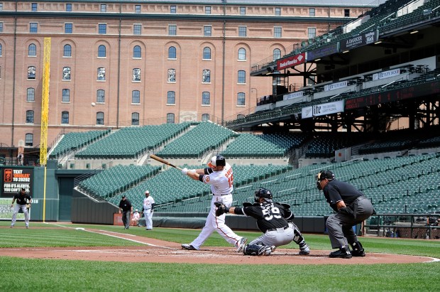 The Orioles' Chris Davis hits a three-run home run in the first inning against the White Sox on April 29, 2015 in Baltimore. (Photo by Greg Fiume/Getty Images)