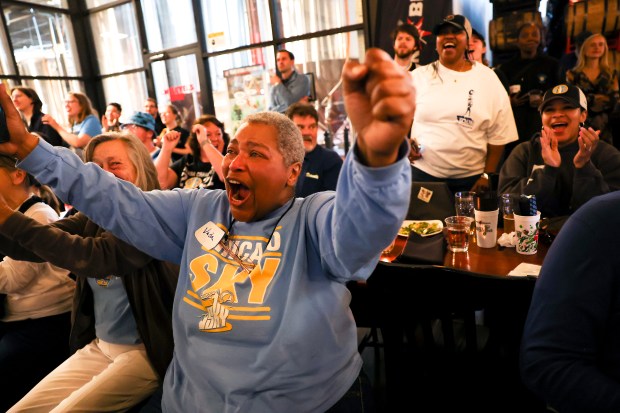 Vada Woods celebrates after Kamilla Cardoso was picked third in the draft by the Chicago Sky during Chicago Sky's WNBA draft watch party at Revolution Brewing in Chicago on April 15, 2024. (Eileen T. Meslar/Chicago Tribune)
