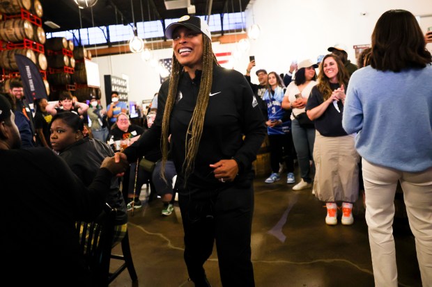 Chicago Sky Head Coach Teresa Weatherspoon celebrates with fans during Chicago Sky's WNBA draft watch party at Revolution Brewing in Chicago on April 15, 2024. (Eileen T. Meslar/Chicago Tribune)