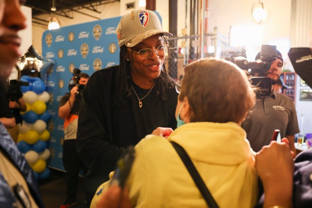 A fan speaks to Chicago Sky player Diamond DeShields during Chicago Sky's WNBA draft watch party at Revolution Brewing in Chicago on April 15, 2024. (Eileen T. Meslar/Chicago Tribune)
