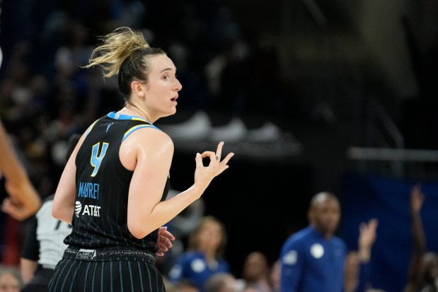 Chicago Sky's Marina Mabrey signals after her three-point basket during the second half of a WNBA basketball game against the Indiana Fever, Thursday, June 15, 2023, in Chicago. (AP Photo/Charles Rex Arbogast)