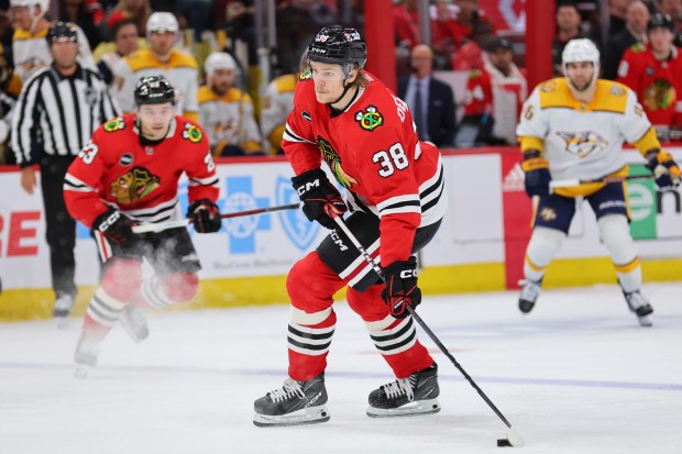 Blackhawks defenseman Ethan Del Mastro takes a shot in his NHL debut against the Predators on April 12, 2024, at the United Center. (Michael Reaves/Getty)