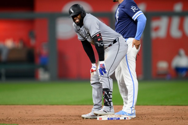 White Sox center fielder Luis Robert Jr. grimaces after hitting a double in the ninth inning against the Royals on April 5, 2024, at Kauffman Stadium in Kansas City, Mo. He would leave the game after the hit with a right hip flexor injury. (Reed Hoffmann/Getty)