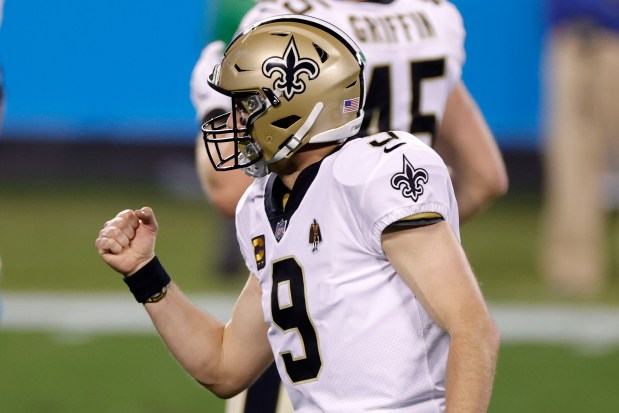 Saints quarterback Drew Brees reacts after throwing a touchdown pass against the Panthers on Jan. 3, 2021. (Jared C. Tilton/Getty Images)