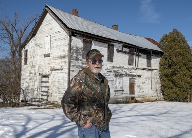 Kankakee Valley Historical Society president John Hudson stands outside the soon to be destructed and reconstructed Collier Lodge in Kouts, Indiana Monday Feb. 21, 2022. "It's like the final pages of a story that started in 1898," Hudson, who owns the lodge and surrounding 160 acres, says of plans to rebuild the lodge at a nearby location. (Andy Lavalley for the Post-Tribune)