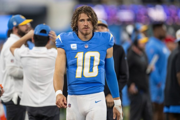 Chargers quarterback Justin Herbert walks on the field during a game against the Bears on Oct. 29, 2023, in Inglewood, Calif. (Kyusung Gong/AP)