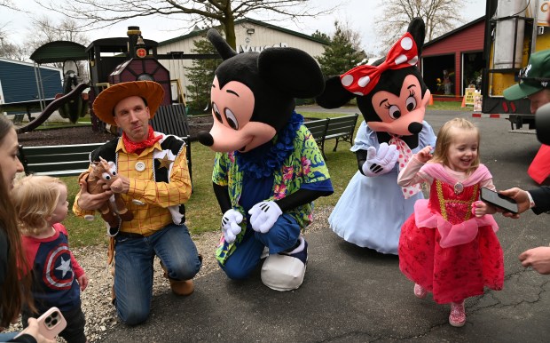 Right, in pink, Georgia Balmer, 3, of Joliet has just visited with Disney characters at the annual Princess Superhero event on March 30, 2024 at Volo Museum in Volo at 27582 Volo Village Road. (Karie Angell Luc/Lake County News-Sun)