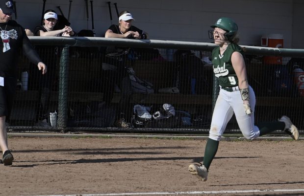 Grayslake Central's Emma Andrews is all smiles running to home plate after hitting a home run during their girls softball game against Antioch at Grayslake Central High School in Grayslake, Tuesday, April 9, 2024. (Michael Schmidt/for the Lake County News-Sun)
