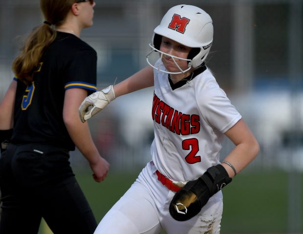 Mundelein's Kieley Tomas (2) rounds third base on her way home after a pop up falls to the grass in right field. Mundelein's girls varsity softball team remains undefeated after beating Warren 9-6 at home in Mundelein, Wednesday, April 10, 2024. (Rob Dicker/for the News Sun)