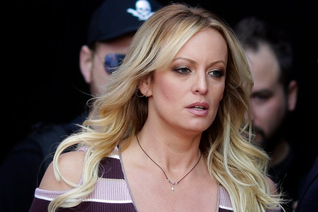 Adult film actress Stormy Daniels arrives for the opening of the adult entertainment fair Venus in Berlin, on Oct. 11, 2018. Daniels' lawyer said she met Wednesday, March 15, 2023, with prosecutors who are investigating hush money paid to her on behalf of former President Donald Trump.