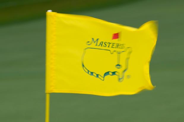 The Master flag waves to the breeze on the second hole during the first round at the Masters golf tournament at Augusta National Golf Club Thursday, April 11, 2024, in Augusta, Ga. (AP Photo/David J. Phillip)