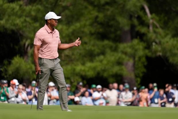 Tiger Woods celebrates after a birdie on the first hole during the first round at the Masters on April 11, 2024, in Augusta, Ga. (Ashley Landis/AP)