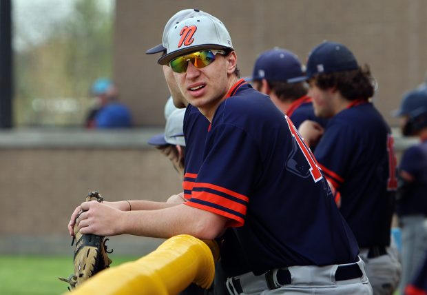 Naperville North's Will Richards in the dugout during the DuPage Valley Conference game against Naperville Central Monday, April 22, 2024, in Naperville. (James C. Svehla/for the Naperville Sun)