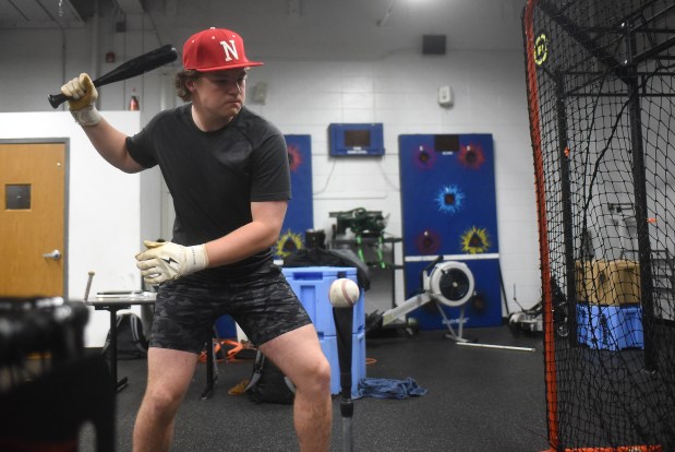 Naperville Central's Troy Kashul gets in some tee work during practice Friday, April 26, 2024 in Naperville, IL. (Steve Johnston/Naperville Sun)