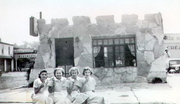 Four employees of the first Prince Castle ice cream shop in Naperville, Jo (Pickell) Weymouth, from left, Elaine (Auner) Schum, Lois Johnson, "Vange" (Whitehead) Gieske, eat cones in front of the Washington Street business in 1931. The photo was provided to the Chicago Tribune in 1999 by Rita Harvard, daughter of Walter Fredenhagen, who co-founded the ice cream store chain. (Rita Harvard)