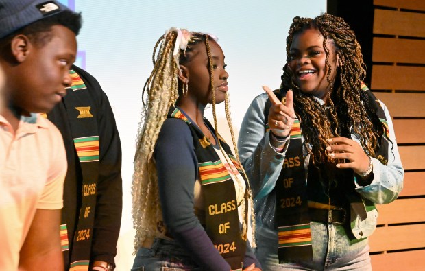 Prospect High School seniors Janiya Wilson, 18, and Jayla Flournoy, 18, were among the students to receive a cultural stole during the Arlington Heights-based Township High School District 214 annual "Black Teen Empowerment Summit" April 19, 2024 at Rolling Meadows High School in Rolling Meadows. (Karie Angell Luc/Pioneer Press)