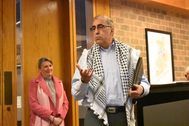 Nizam Khatib speaks in support of a village resolution in Burr Ridge on Monday calling for a ceasefire in the Israel-Hamas war. (Jesse Wright)