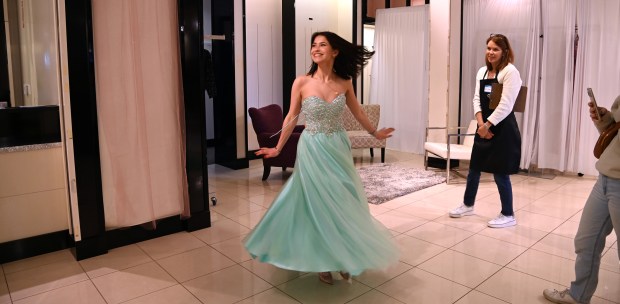 Ines Delhors, 19, an exchange student from France and graduating senior at Barrington High School, was among the dozens of girls would turned out to "Giving Dreams Pop-Up Prom Boutique" April 5, 2024 at The Arboretum of South Barrington. Barrington Giving Day, a nonprofit community organization as well as the name of its events, hosted the free giveaway. (Karie Angell Luc/Pioneer Press)