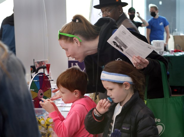 Danyelle Dron with her son Myles, 5, and Kara, 7, attended the Oak Park and River Forest Chamber of Commerce health and wellness fair held April 21, 2024 at the Community Recreation Center in Oak Park. (James C. Svehla/Pioneer Press)