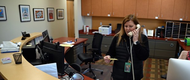 Ginny Hiltz of Northbrook, Greenbriar School principal, makes a prepared announcement over the loudspeaker to the school that in a few minutes, students and staff would be going outside to experience the solar eclipse at Greenbriar School in Northbrook on April 8, 2024. (Karie Angell Luc/for the Pioneer Press)