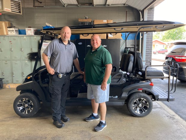 Posen police Chief William Alexander, left, and Mayor Frank Podbielniak have connected with community members driving in the department's golf cart.