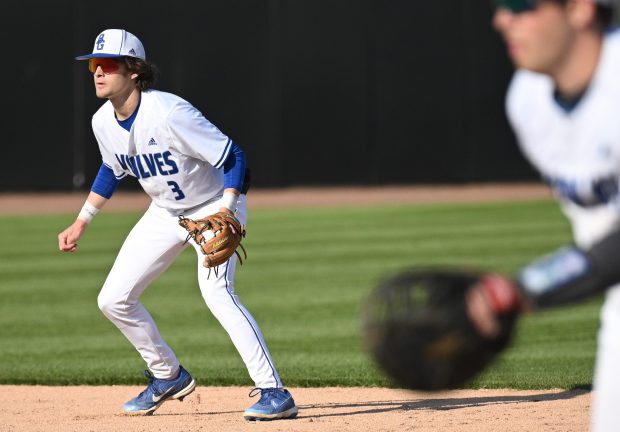 Boone Grove's Trey Pitcock, on left, keeps his eye on the ball during a game against Morgan Township on Monday, April 24, 2023. (Kyle Telechan for the Post-Tribune)