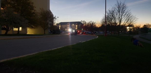 Lights popped on during eclipse totality outside of Memorial Stadium at Indiana University in Bloomington on Monday. (Carrie Napoleon/Post-Tribune)