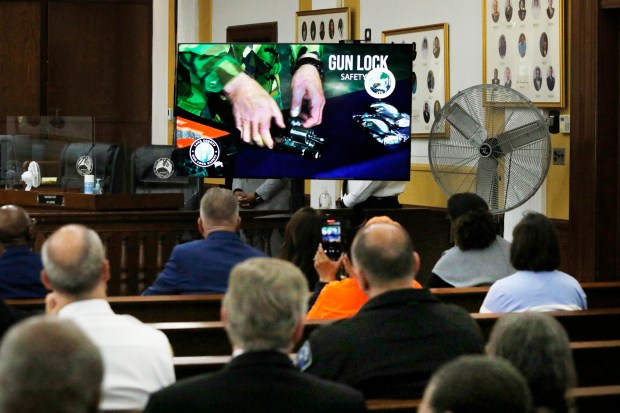 The audience watches the debut of three short gun safety lock videos produced by, and in partnership with, Gary City Councilman and director of the West Side Theatre Guild, Mark Spencer. The videos are both instructional and emotional. The Lake County Prosecutor's Office hosted the press conference at Gary City Hall/Council Chambers on April 22, 2024. (John Smierciak/for the Post-Tribune)