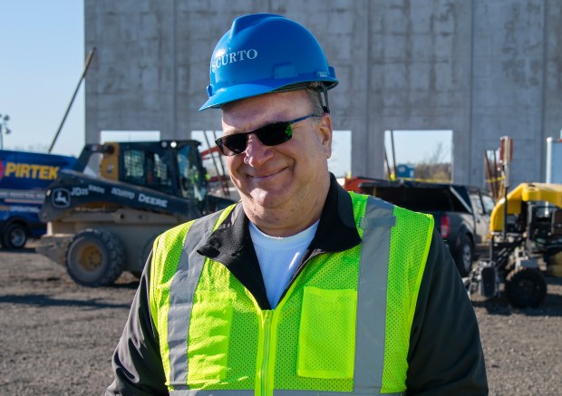 David Scurto of Scurto Cement Construction Ltd. discusses the foundation project for a cold-storage facility in Hobart on Saturday, April 6, 2024. (Michael Gard/for the Post-Tribune)