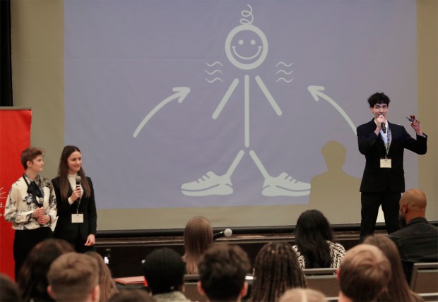 Munster High School students, Josephine Pirok (left), Brooke Weatherly and Nabeel Rabie describe their presentation to the judges during the Innovate WithIN Region 4 Finals, hosted on the campus of Purdue Northwest along with the Society of Innovators on Friday, April 19, 2024. (John Smierciak/for the Post-Tribune)