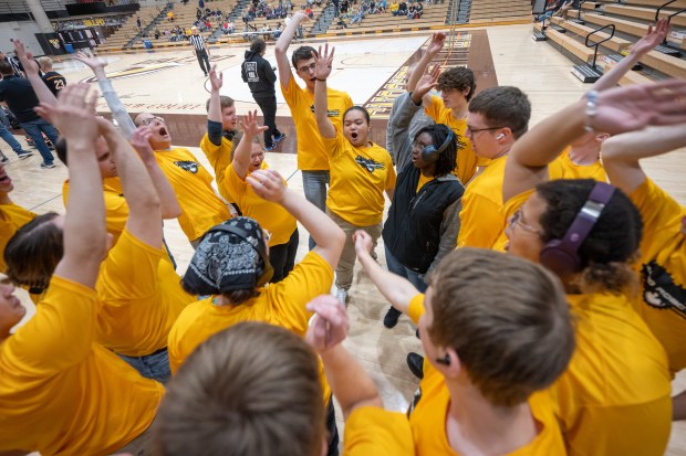 Valparaiso University robotic football build and drive team members cheer after a huddle before facing off against Ohio Northern University in the 11th annual Collegiate Robotic Football Conference in Valparaiso on Saturday, April 13, 2024. (Kyle Telechan/for the Post-Tribune)