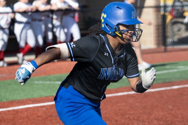 Lake Central's Jolie Adams breaks away from first during a game against Crown Point on Monday, April 15, 2024. (Kyle Telechan/for the Post-Tribune)