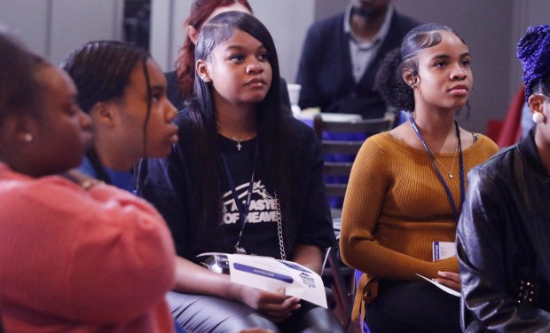 Iyana Thomas of Westside Leadership Academy (center), along with other award winners listen to speakers during the 5th Gary STEM Signing Day honoring 10 area students. Boeing and the Chicago Area Business Aviation Association Educational Foundation hosted the event in Gary on April 23, 2024. (John Smierciak/for the Post Tribune)