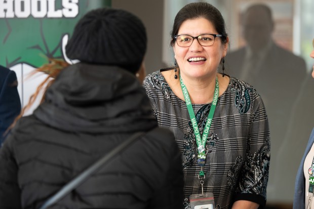 Valparaiso High School principal Veronica Tobon speaks with prospective teacher Atinuke Bada, of Hobart, during the Indiana University School of Education's seventh-annual Teacher Recruitment Fair on Friday, April 5, 2024. (Kyle Telechan/for the Post-Tribune)