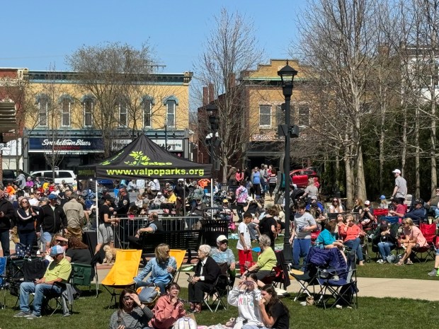 Hundreds of people gather on Monday, April 8, 2024, at Central Park Plaza in downtown Valparaiso for an eclipse viewing party put on by the Valparaiso Parks Department. (Deena Lawley-Dixon/for Post-Tribune)