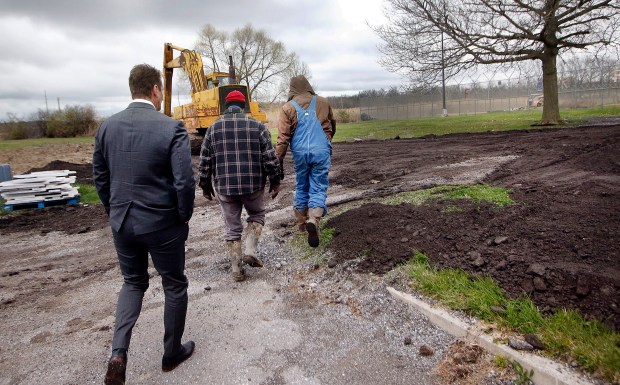 Lake County Juvenile Court Judge Thomas Stefaniak Jr. (center) leads U.S. Rep. Frank Mrvan, D-Highland, (left) on a tour in the farm area that is being enlarged with a vertical garden at the Lake County Juvenile Justice Center on April 5, 2024. (John Smierciak/Post-Tribune)