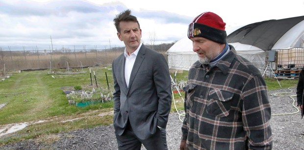 Lake County Juvenile Court Judge Thomas Stefaniak Jr. (right) leads Congressman Frank Mrvan (left) on a tour in the farm area that is being enlarged with a vertical garden at the Lake County Juvenile Justice Center on April 5, 2024. (John Smierciak/Post-Tribune)