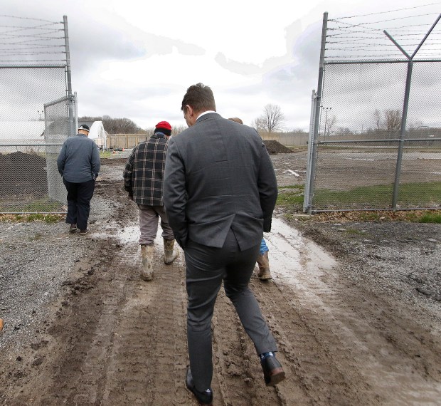 Lake County Juvenile Court Judge Thomas Stefaniak Jr. (center) leads Congressman Frank Mrvan (right) on a tour in the farm area that is being enlarged with a vertical garden that would expand Juvenile Justice Center's current farm program on Friday, April 5, 2024. (John Smierciak/for the Post Tribune)