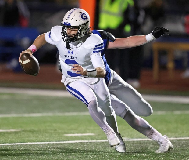 Geneva's Nate Stempowski (3) eludes the defense against St. Charles North during a DuKane Conference game in St. Charles on Friday, Oct. 20, 2023.