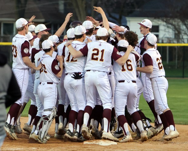 Lockport celebrates their win over Andrew in Lockport Monday, April 8, 2024. (James C. Svehla/for the Daily Southtown)