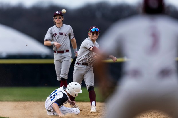 Brother Rice's Jackson Natanek throws the ball to complete a double play against Lincoln-Way East during a nonconference game in Frankfort on Wednesday, April 10, 2024. (Vincent D. Johnson/for the Daily Southtown)